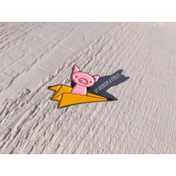 Pin's Petit cochon sur avion en papier