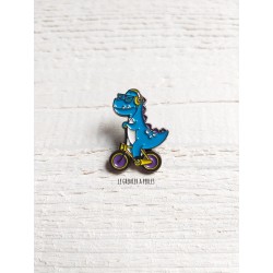 Pin's Dino à vélo