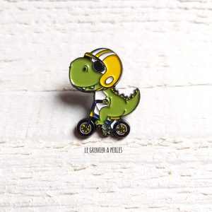 Pin’s Dino à vélo