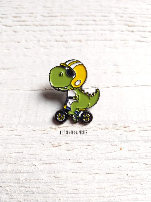 Pin's Dino à vélo